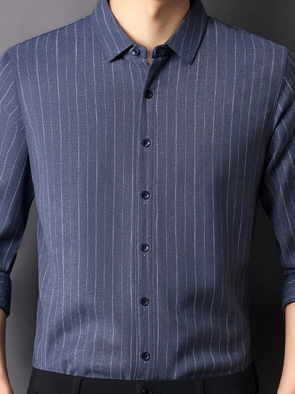 Close-up view of GKSEN blue pinstripe men’s shirt showing collar, dark buttons, vertical stripes and refined fabric texture.