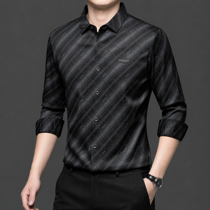 Model wearing GKSEN men's charcoal black and silver grey diagonal check Imported Stretch shirt with black trousers