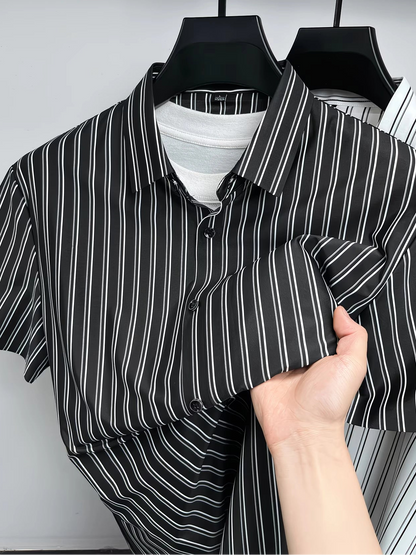 Close hanger view of the GKSEN black white pinstripe men’s shirt showing the collar, button placket, short sleeves, and folded fabric detail.