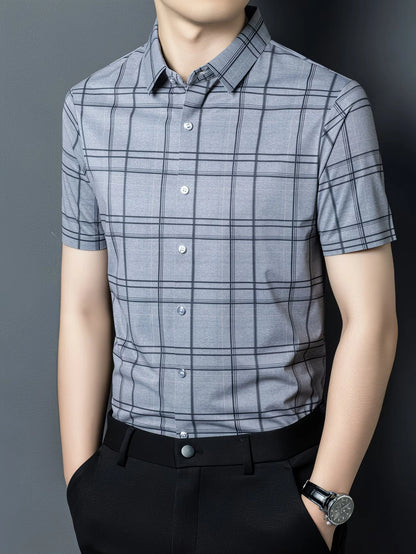 GKSEN blue grey windowpane check men’s shirt shown in a three-quarter front model pose with short sleeves and collar detail.