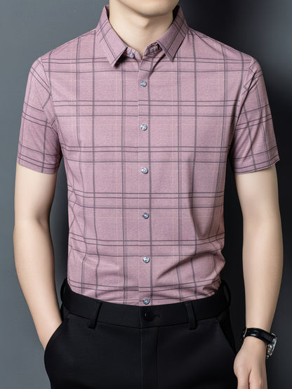 GKSEN men’s shirt in dusty mauve windowpane checks shown in a front model pose with short sleeves, collar, and light button detail.