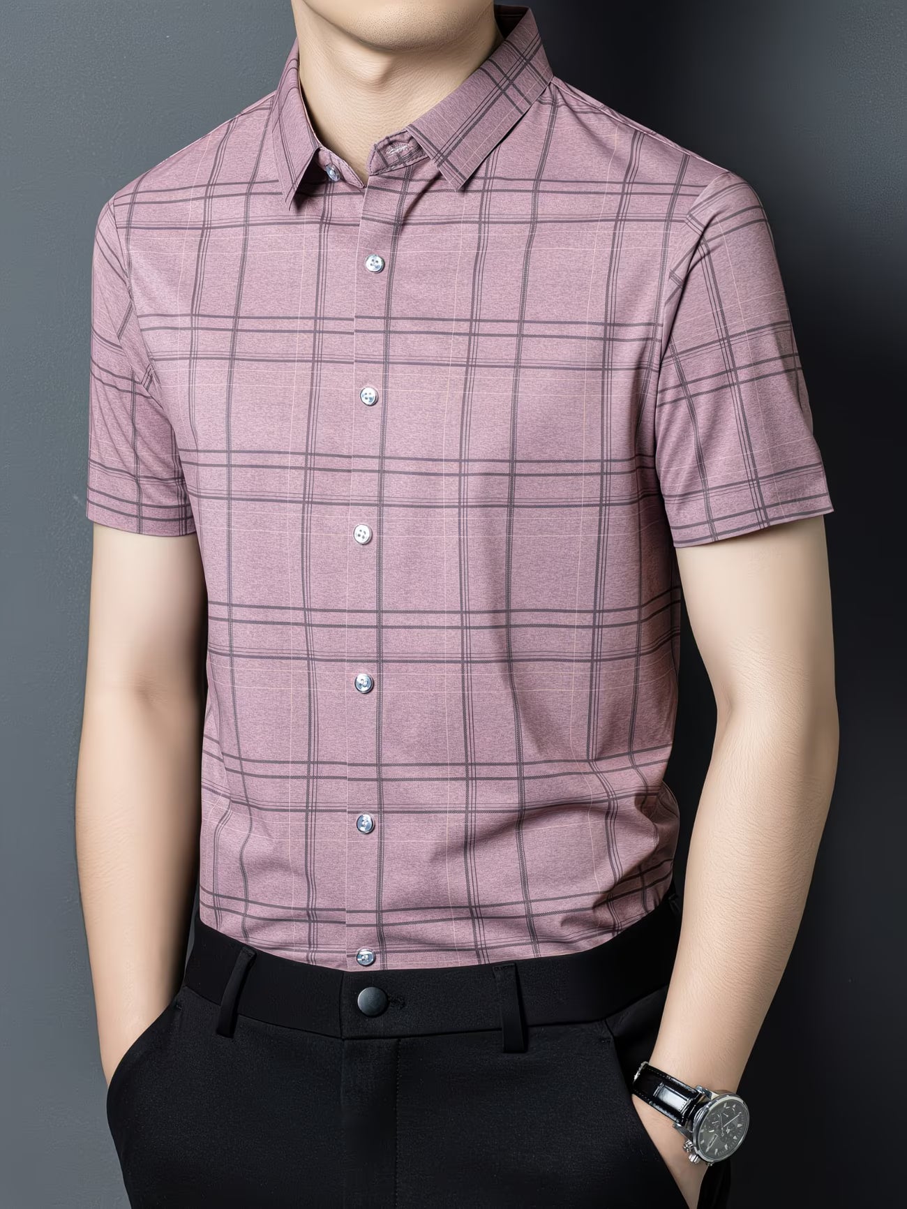 GKSEN dusty pink windowpane check men’s shirt shown in a three-quarter front model pose with collar and short sleeve styling.