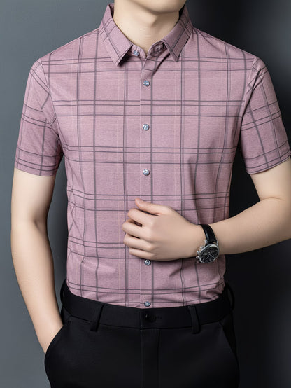 GKSEN mauve pink checked men’s shirt shown from the front with short sleeves, grey check lines, and the model adjusting the shirt.