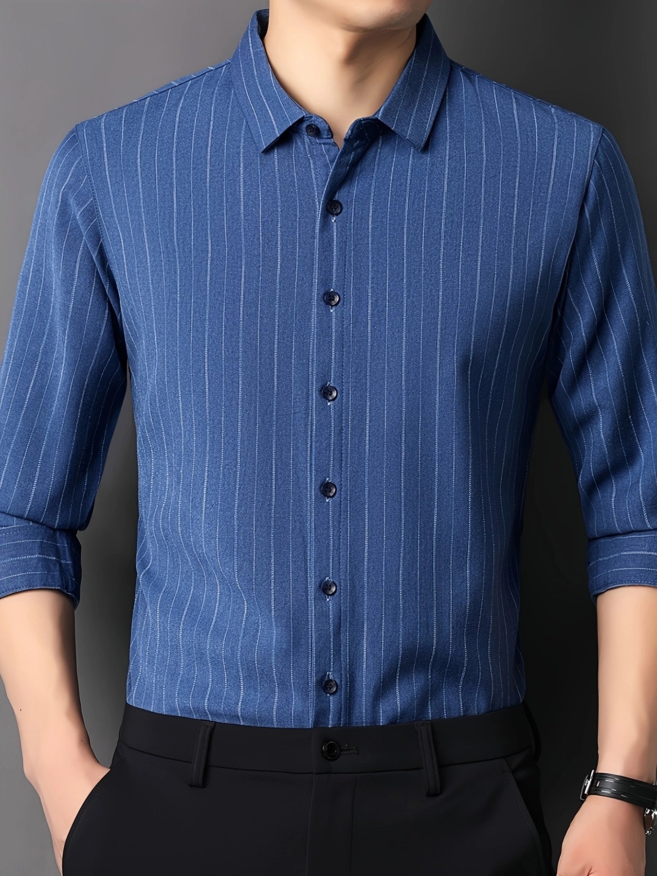 GKSEN men’s shirt in royal blue vertical stripes shown in a clean front view with black trousers for a sharp formal look.