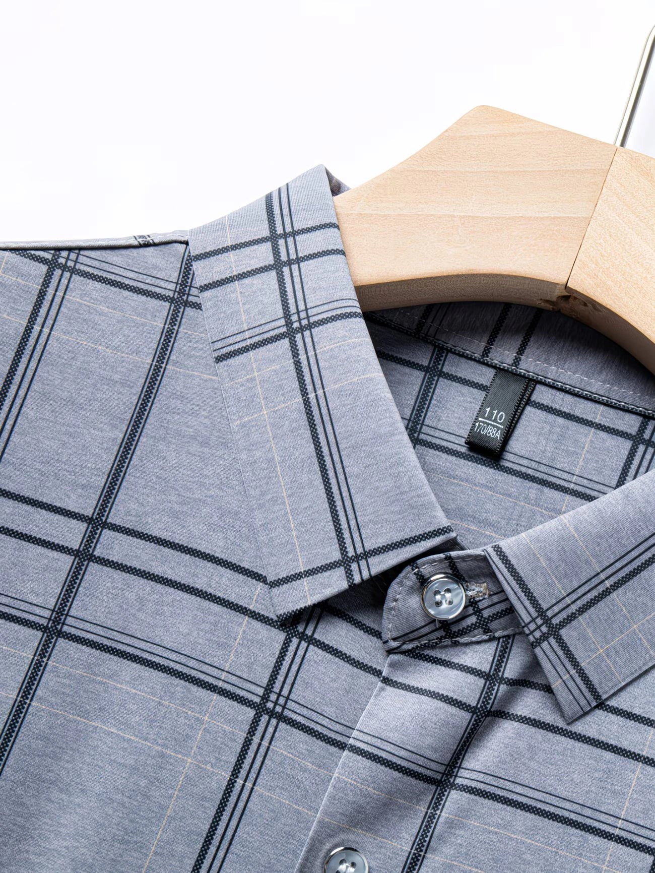 Close-up fabric texture view of the GKSEN steel grey windowpane check men’s shirt showing the grey base and dark check lines.