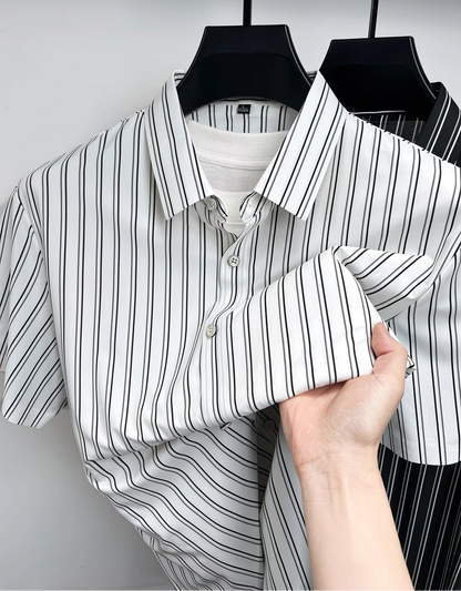 GKSEN men’s shirt in white with black vertical stripes shown on a hanger with collar, buttons, short sleeves, and folded fabric detail.