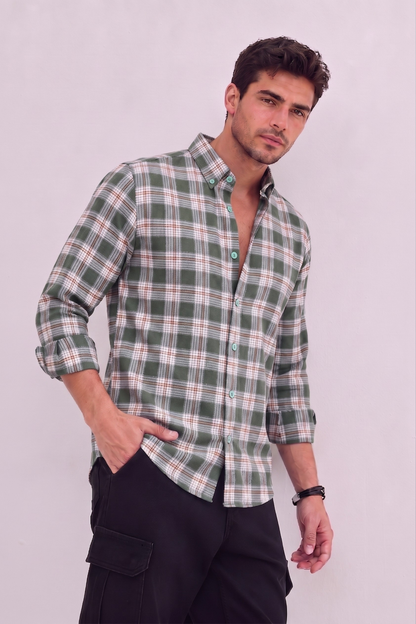 Male model wearing GKSEN olive green classic check shirt with black cargo pants