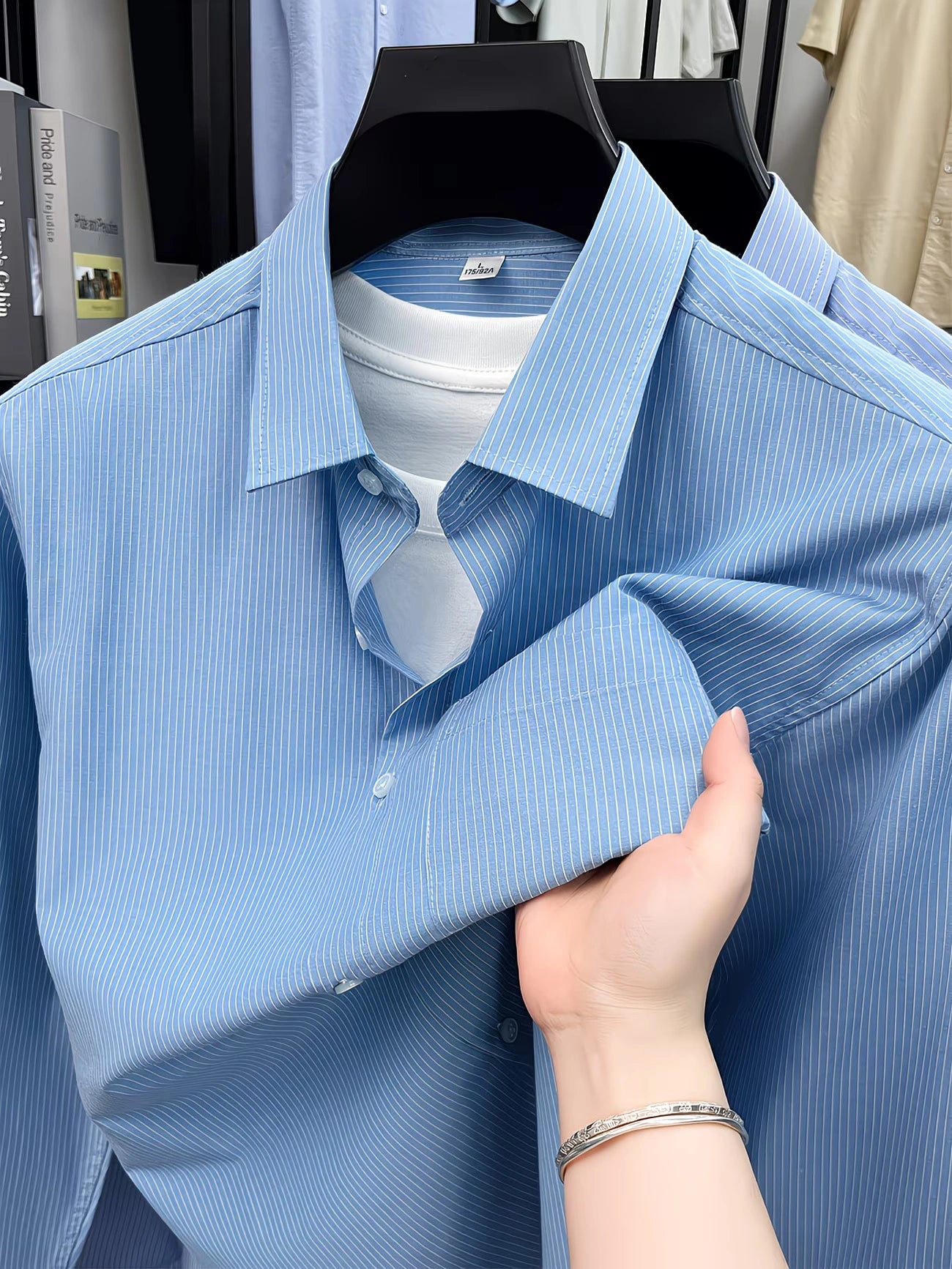 GKSEN men’s sky blue fine stripe full sleeve shirt displayed on hanger with clean collar and front open styling.