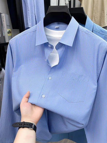 Close view of GKSEN sky blue striped men’s shirt showing front pocket, button detail, and fine stripe pattern.