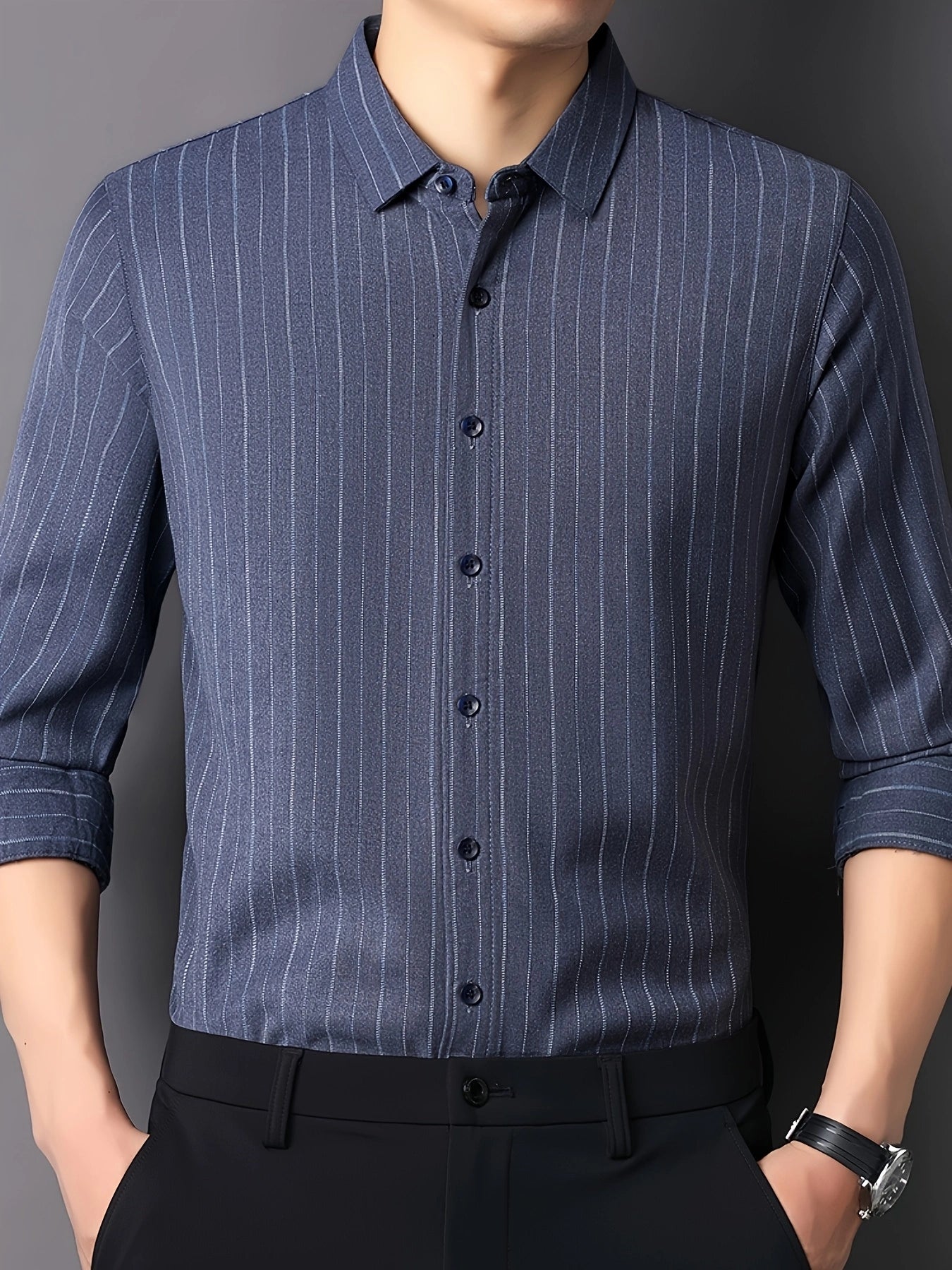 GKSEN steel blue pinstripe men’s shirt shown in front view with classic collar, dark buttons and rolled sleeve styling.